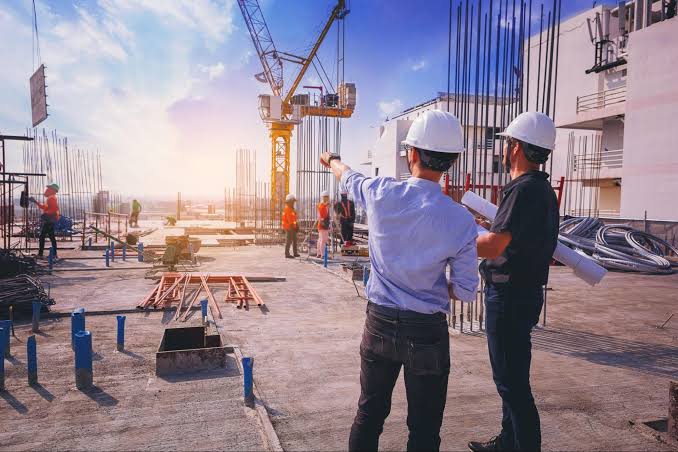 Nexus Structural Engineers reviewing steel blueprints